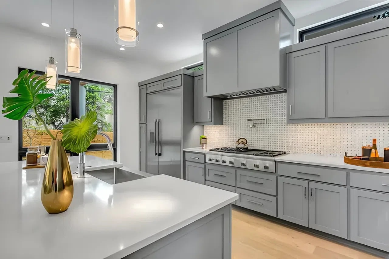 Gray painted cabinets with smooth, flawless finishes in a modern kitchen by a painter in Jarrettsville, MD