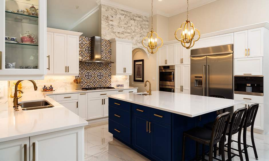 Modern kitchen cabinets paired with a bold navy island by a professional interior painter in Phoenix, MD